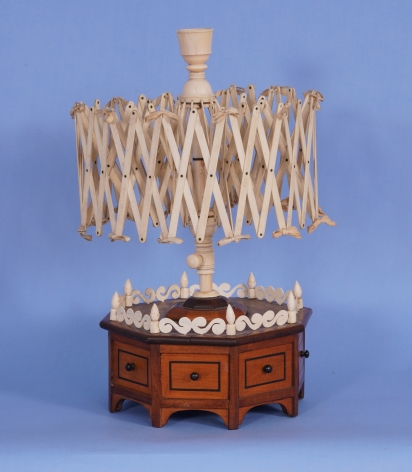 WHALE IVORY AND WHALEBONE SWIFT ON AN OCTAGONAL WOODEN BASE AMERICAN mid-19th Century