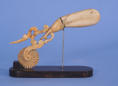 WHALE IVORY AND BALEEN PIE CRIMPER IN THE FORM OF A "NAUGHTY LADIES LEG