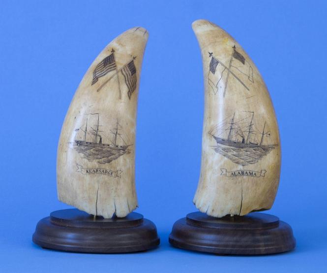 Pair of Scrimshaw Teeth One identified as the "Alabama" and the other the "Kearsarge" each with a pair of Crossed Polychrome Flags below the tip. American circa 1864.