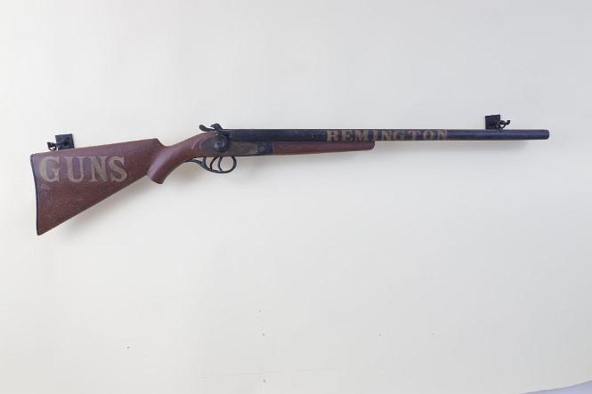 Carved and Painted Trade sign Featuring a Highly Realistic Double Barrel Shot Gun Titled in Shawdowed Letters "REMINGTON GUNS"