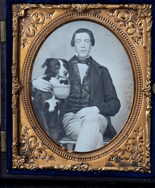 Sixth Plate daguerreotype depicting a Young Man With His Dog Holding a Nantucket Basket in his Mouth, American circa 1855