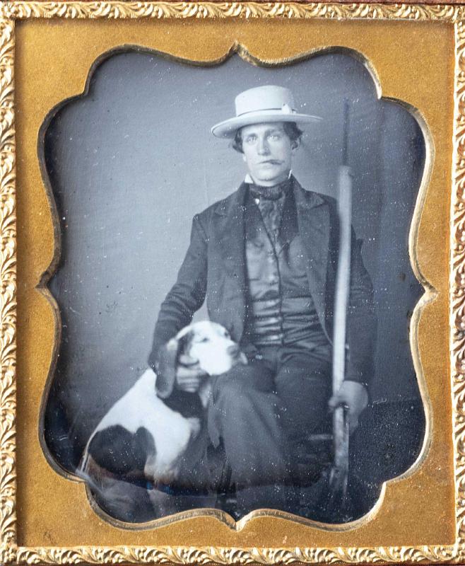 Sixth Plate Daguerreotype of Man with Sailors Hat Holding a Whaling Implement in one Hand and a Dog in the Other