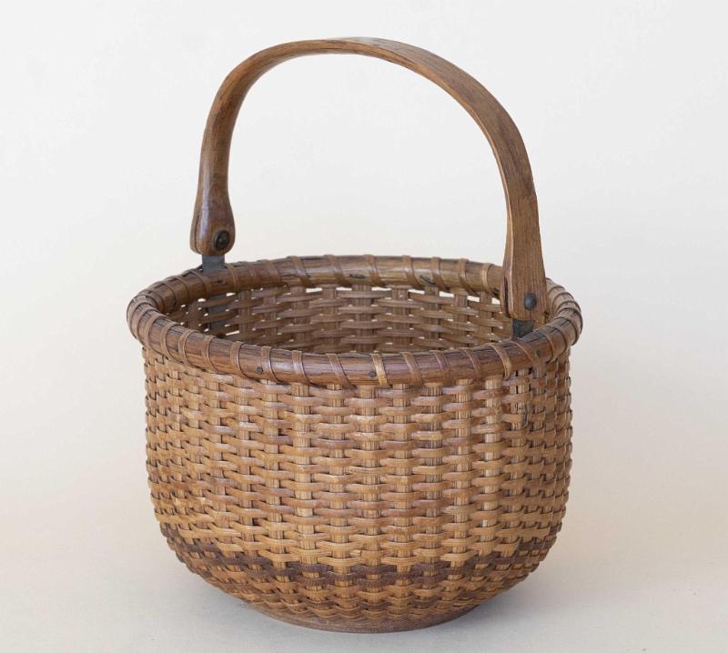 Small 5 1/2 Inch Round Nantucket Basket with Swing Handle and Brass Ears, American circa 1890