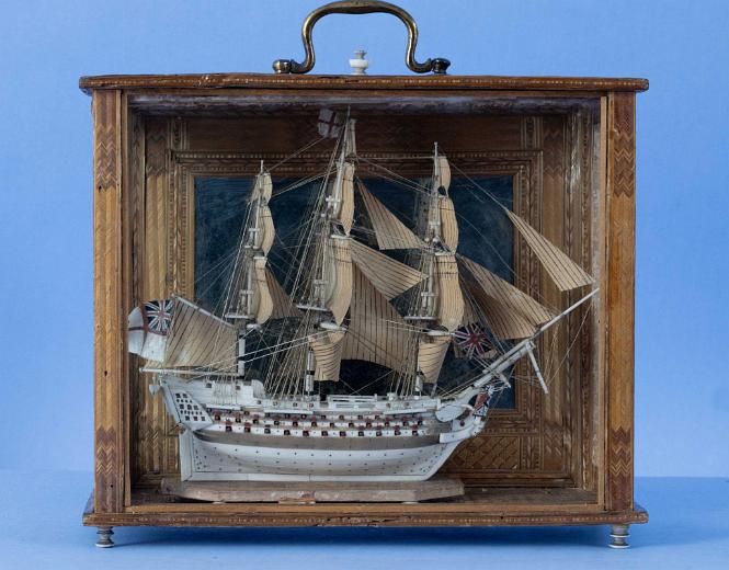 NAPOLEONIC PRISONER-OF-WAR CARVED BONE SHIP MODEL IN A STRAW WORK CASE

